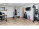 Basement home gym with exercise equipment, punching bag, desk, and recessed ceiling lights at 3332 Langston Cir, Apex, NC 27539