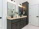Bathroom with dual vanities and granite countertops at 3332 Langston Cir, Apex, NC 27539