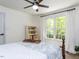 Bright bedroom with a large window overlooking the backyard at 3332 Langston Cir, Apex, NC 27539
