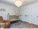 Cozy Bedroom features a crib, accent rug, and lots of natural light at 3332 Langston Cir, Apex, NC 27539