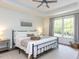 Bright bedroom with a large window overlooking the backyard at 3332 Langston Cir, Apex, NC 27539