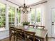 View of dining room with large windows offering lots of natural light and view to the yard at 3332 Langston Cir, Apex, NC 27539