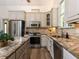 Spacious kitchen featuring a granite countertop, stainless steel appliances, and hardwood flooring at 3332 Langston Cir, Apex, NC 27539