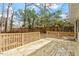 A spacious wooden back deck is surrounded by wooden railings, perfect for relaxing or entertaining guests at 3408 Brentwood Rd, Raleigh, NC 27604
