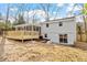 Exterior back of home with deck, basement entrance, and screened porch at 3408 Brentwood Rd, Raleigh, NC 27604