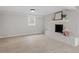 Spacious basement featuring a brick fireplace and updated flooring at 3408 Brentwood Rd, Raleigh, NC 27604