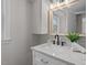 Modern bathroom with marble countertop and updated hardware at 3408 Brentwood Rd, Raleigh, NC 27604