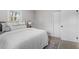 Bedroom featuring large windows, closet, plush carpet, and neutral color scheme at 3408 Brentwood Rd, Raleigh, NC 27604