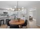 Open concept dining area featuring an eat in kitchen with modern lighting and neutral colors at 3408 Brentwood Rd, Raleigh, NC 27604