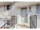 Home's front door and exterior with wrought iron railings and freshly painted white brick at 3408 Brentwood Rd, Raleigh, NC 27604