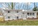 Charming two-story home with landscaped yard and freshly painted white brick at 3408 Brentwood Rd, Raleigh, NC 27604