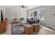 Comfortable living room featuring lots of natural light, a modern gray sofa, and neutral colors at 3408 Brentwood Rd, Raleigh, NC 27604