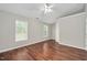 Spacious bedroom with hardwood floors and bright natural light at 4000 Volkswalk Pl, Raleigh, NC 27610