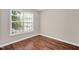 Bedroom with window and hardwood floors at 4000 Volkswalk Pl, Raleigh, NC 27610