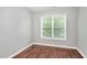 Bright bedroom with hardwood floors and window view at 4000 Volkswalk Pl, Raleigh, NC 27610