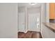 Bright entryway featuring hardwood floors and two white doors at 4000 Volkswalk Pl, Raleigh, NC 27610