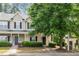 Charming townhome featuring a covered porch and well-maintained landscaping at 4000 Volkswalk Pl, Raleigh, NC 27610
