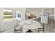 Dining room with white table, sliding glass doors and view of modern kitchen at 441 White Birch Ln # 66, Angier, NC 27501