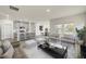 Open-concept living room and kitchen with modern decor, gray tones and lots of natural light at 441 White Birch Ln # 66, Angier, NC 27501
