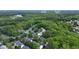 Aerial view of the community with mature trees near NC State, Lake Johnson, and Downtown Raleigh at 4540 Mistiflower Dr, Raleigh, NC 27606