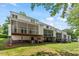Exterior view of home featuring screened decks and well-maintained landscaping at 4540 Mistiflower Dr, Raleigh, NC 27606