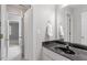 Bathroom featuring a vanity with a black countertop and a shower with a curtain at 4540 Mistiflower Dr, Raleigh, NC 27606