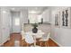 Dining room is conveniently located near the kitchen and entryway, with bright lighting and modern accents at 4540 Mistiflower Dr, Raleigh, NC 27606