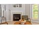 Elegant fireplace with marble surround and decorative mantle in a cozy living space at 4540 Mistiflower Dr, Raleigh, NC 27606