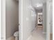 Hallway leading to a bedroom and bathroom, with a linen closet and neutral tones at 4540 Mistiflower Dr, Raleigh, NC 27606