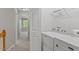 Bright laundry area with a Maytag washer and dryer, and ample storage at 4540 Mistiflower Dr, Raleigh, NC 27606