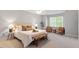 Spacious main bedroom with a seating area and natural light from the window at 4540 Mistiflower Dr, Raleigh, NC 27606