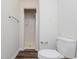 White tiled walk-in shower stall with handheld shower head and white toilet at 4602 Millstone Dr # C, Raleigh, NC 27604