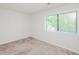 Neutral bedroom features carpet and a bright window at 4602 Millstone Dr # C, Raleigh, NC 27604