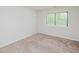 Bedroom features carpeted floors and a window with mini blinds at 4602 Millstone Dr # C, Raleigh, NC 27604