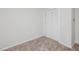 Neutral bedroom features carpet, white walls, and a closet at 4602 Millstone Dr # C, Raleigh, NC 27604