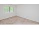 Neutral bedroom features carpet and a bright window at 4602 Millstone Dr # C, Raleigh, NC 27604