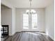Dining room features modern floors, a chandelier, and French doors at 4602 Millstone Dr # C, Raleigh, NC 27604