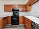 Updated kitchen boasts white counters, new appliances, and wood cabinets at 4602 Millstone Dr # C, Raleigh, NC 27604