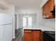 Bright kitchen features stainless steel appliances, wood cabinets, and a gray countertop island at 4602 Millstone Dr # C, Raleigh, NC 27604