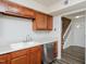 Updated kitchen features white counters, stainless steel dishwasher, and dark wood cabinets at 4602 Millstone Dr # C, Raleigh, NC 27604