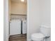 Small laundry and powder room includes washer, dryer, and adjacent toilet at 4602 Millstone Dr # C, Raleigh, NC 27604