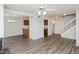 Open floor plan features modern floors, a ceiling fan, stairs, and half bath at 4602 Millstone Dr # C, Raleigh, NC 27604