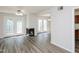Bright living room boasts modern floors, a fireplace, and French doors to backyard at 4602 Millstone Dr # C, Raleigh, NC 27604