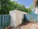 Backyard shed with a door, providing extra storage space in a fenced-in area at 4602 Millstone Dr # C, Raleigh, NC 27604