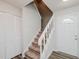 Carpeted staircase to the second story with closet and entry door at 4602 Millstone Dr # C, Raleigh, NC 27604