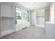 Spacious walk-in closet with custom shelving and storage, plus window seat at 4908 Vallery Pl, Raleigh, NC 27604