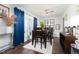 Dining room featuring dark wood floors, chandelier, natural lighting and decorations at 4908 Vallery Pl, Raleigh, NC 27604