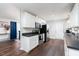 Kitchen featuring white cabinets, stainless steel appliances, and dark countertops at 4908 Vallery Pl, Raleigh, NC 27604