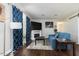 Living room with sofa, decorative fireplace, dark wood floors, and natural light at 4908 Vallery Pl, Raleigh, NC 27604