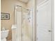 Bathroom with glass shower doors and a neutral color scheme providing a spa-like feel at 5026 Celtic Ct, Raleigh, NC 27612
